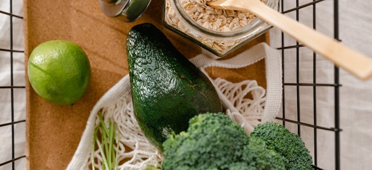 A collection of fresh ingredients including avocado, broccoli, and oats for a nutritious meal prep.