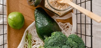 A collection of fresh ingredients including avocado, broccoli, and oats for a nutritious meal prep.