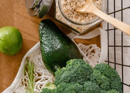 A collection of fresh ingredients including avocado, broccoli, and oats for a nutritious meal prep.